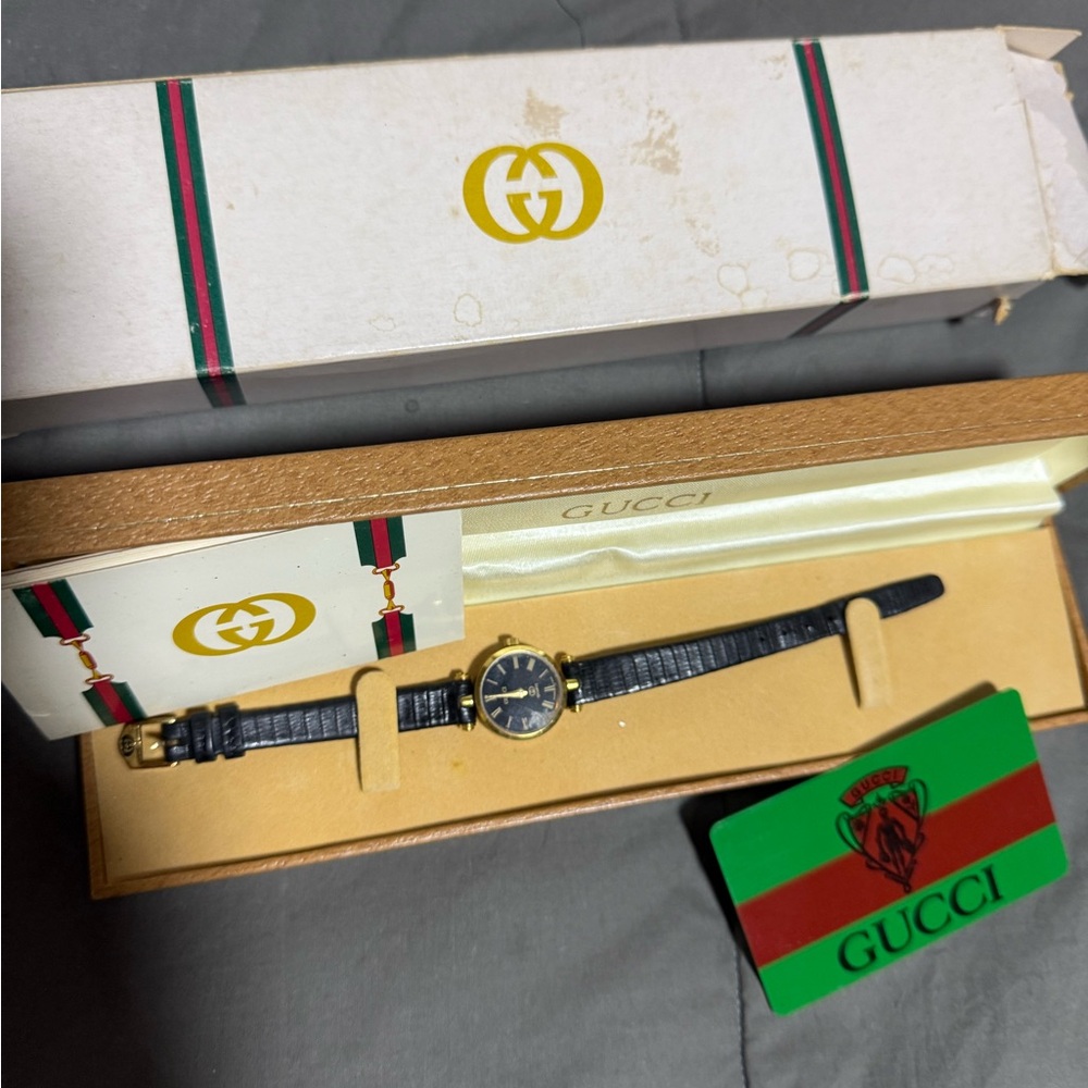 Gucci Gold and Black Leather Watch